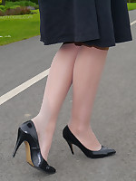 Sexy brunette Debbie takes a stroll into the park in a seductive dress and gorgeous matching threatening brazen heel stilettos