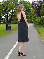 Sexy brunette Debbie takes a stroll into the park in a seductive dress and gorgeous matching threatening brazen heel stilettos