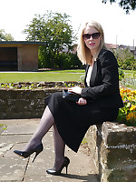 Sexy secretary Milf Jenny takes her breakfast break outdoors debilitating her nice suit, sunglasses, sexy nylons and tall shiny black stilettos