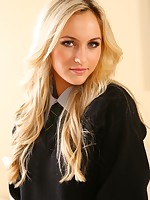 Blonde strips out of her university uniform in the lounge.